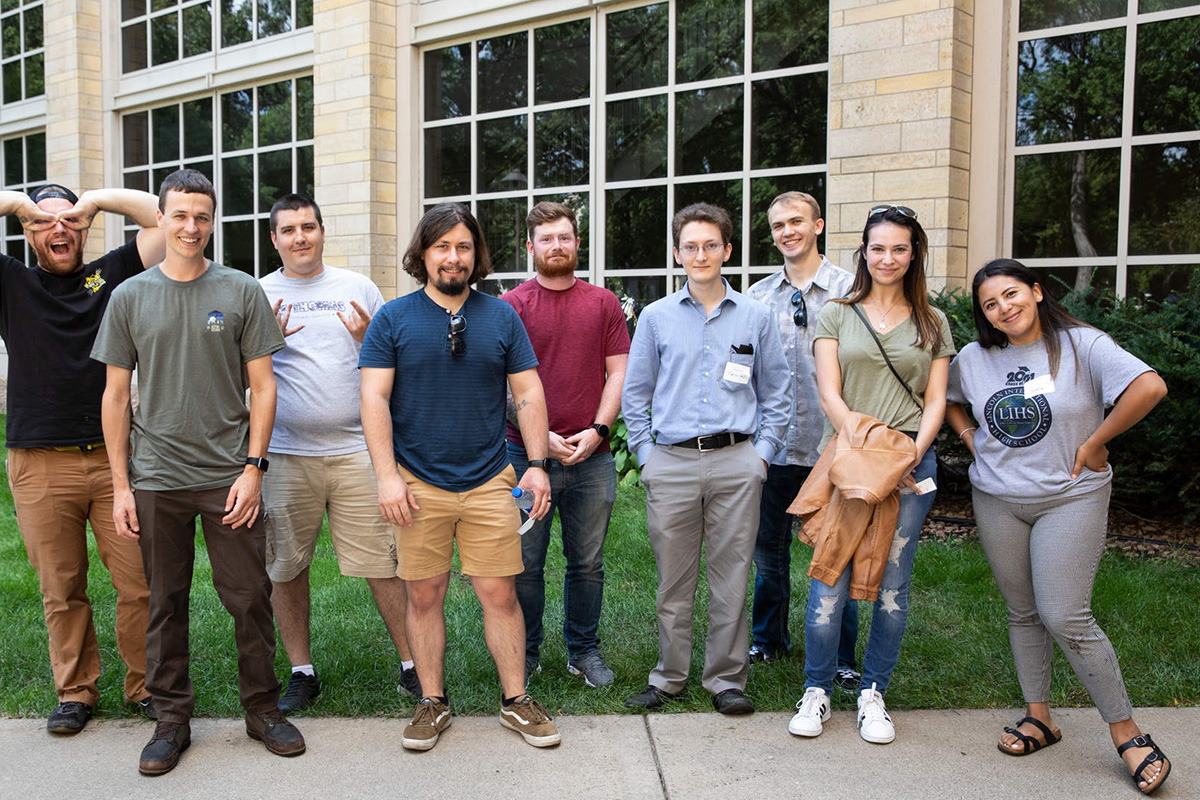 A group of transfer students gather outside.