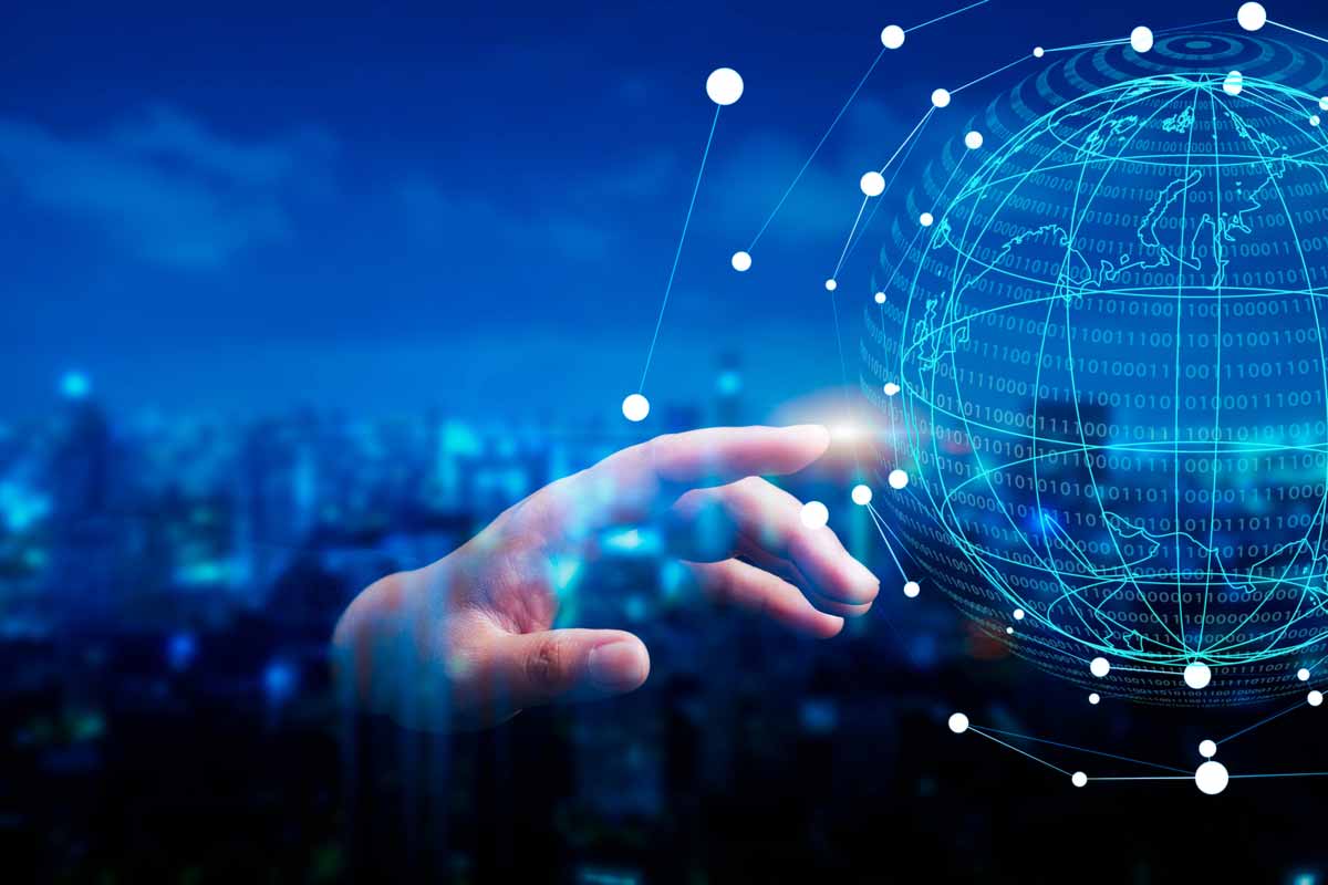 Hand touches a holographic globe